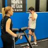Trainer explaining the gym